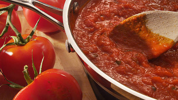 Mariana sauce simmering in pan Mariana sauce simmering in pan tomato sauce stock pictures, royalty-free photos & images