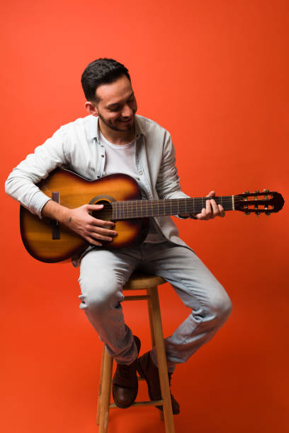 istock Attractive singer enjoying the music 1370302170