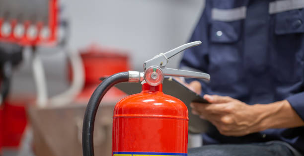 istock Engineer are checking and inspection a fire extinguishers tank in the fire control room for safety training and fire prevention. 1370303114