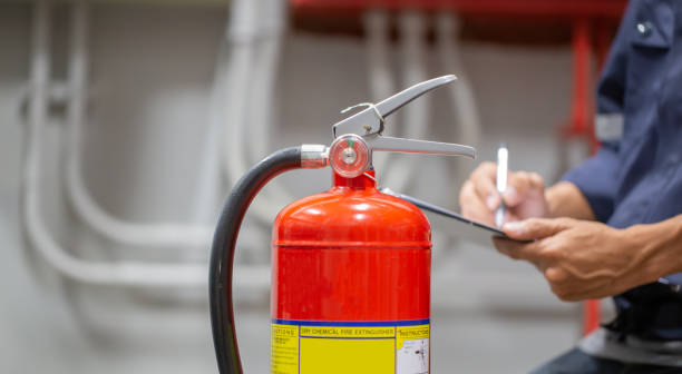 istock Engineer are checking and inspection a fire extinguishers tank in the fire control room for safety training and fire prevention. 1370303147