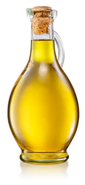 Photo of Bottle of olive oil isolated on white background. File contains clipping path.