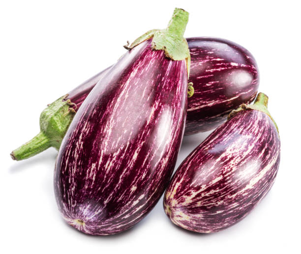 istock Fresh striped aubergines or eggplants with leaf and slices isolated on white background. 1370303627