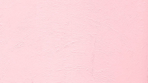 テクスチャの背景のためのピンクのコンクリートの壁 - 薄ピンク ストックフォトと画像