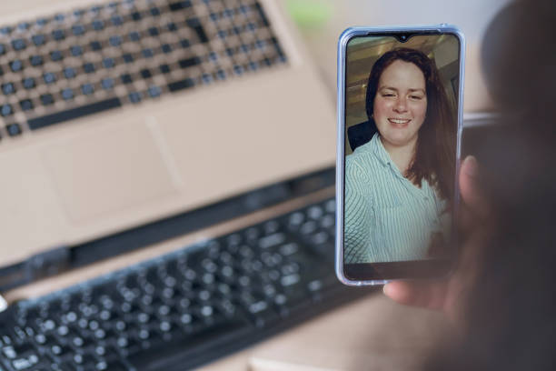 istock Executive woman talking by video call with the client through her phone 1370307098