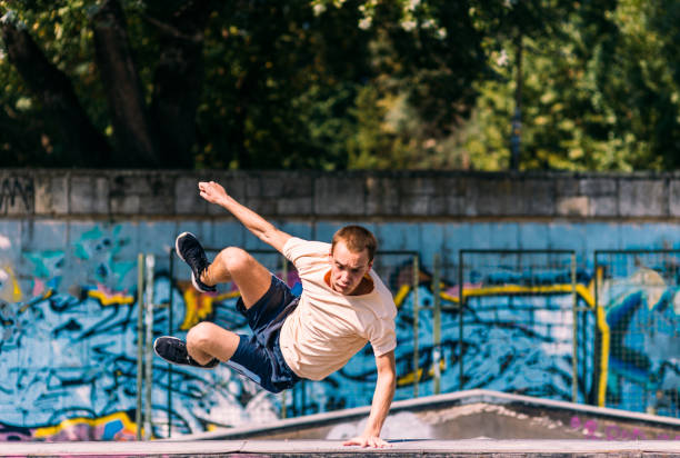 istock Professional parkour man running over obstacles 1370307181
