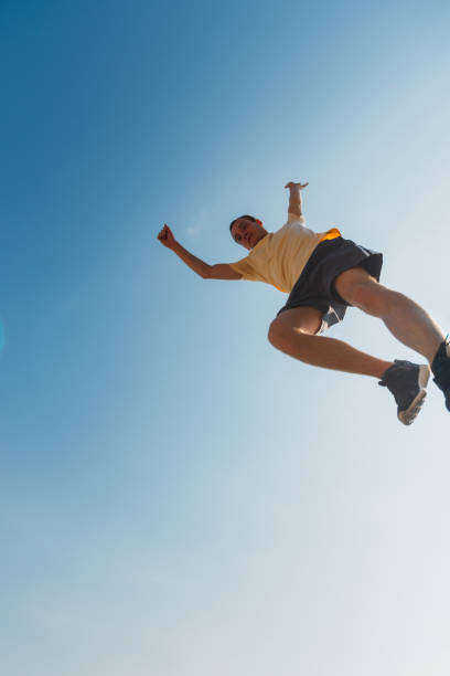 istock Parkour guy jump over obstacles outdoors 1370307704