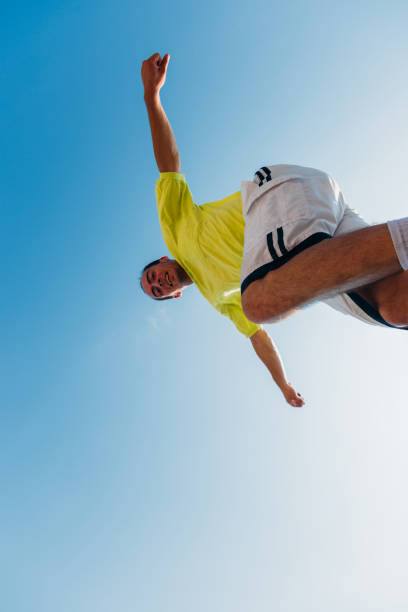 istock Parkour man doing tricks in the air 1370307713