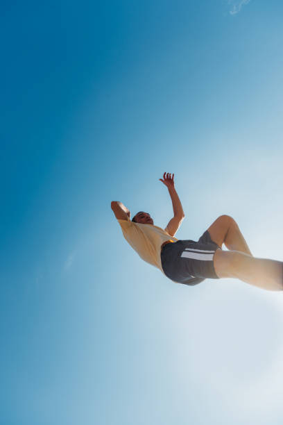 istock Caucasian man jump high in the air while doing parkour 1370307720