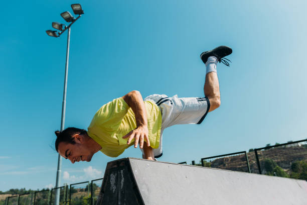 istock Parkour man exercise outdoors in skatepark 1370308219