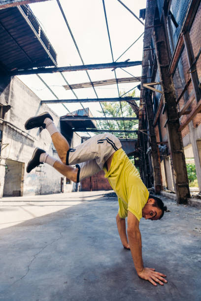 istock Parkour man exercise handstand outdoors 1370308236