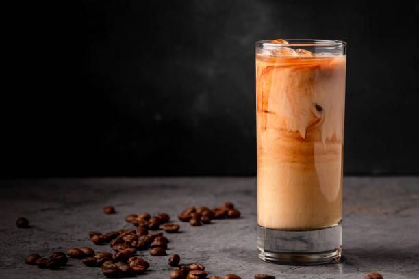 istock Ice coffee in a glass with cream poured over 1370309362