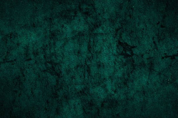 istock Scattered dark spots and grunge textures on a dark cyan color concrete wall surface for background 1370315402