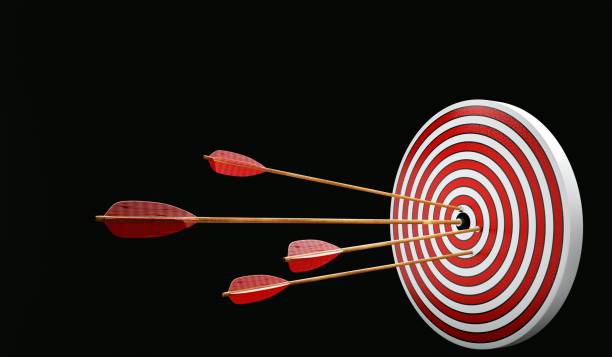 istock target with arrow in bullseye hitting the target. Black background. 3D Render. 1370315758