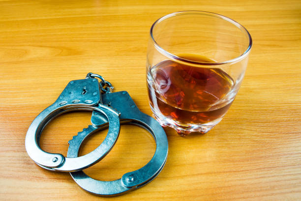 istock Handcuffs and a Whiskey 1370316193