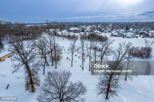 Snowy Sledding Hill Through Trees Stock Photo - Download Image Now - Dayton - Ohio, Ohio, Winter
