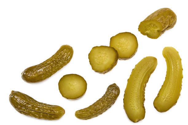 istock marinated pickled cucumbers with slices isolated on white background. Clipping path and full depth of field. Top view 1370321672