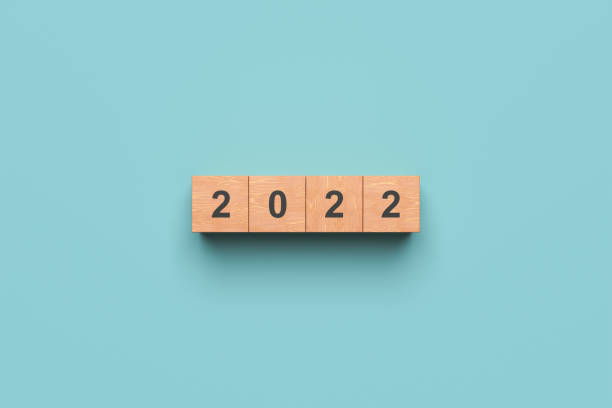 istock Wooden blocks 2022 on a blue background. 1370322161