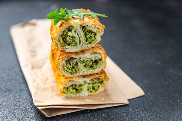 rollini savory pastries spinach, cheese puff pastry fresh phyllo dough healthy meal takeaway food snack on the table
