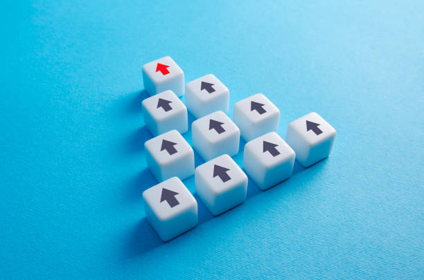 istock Blocks with arrows pointing in the same direction. Movement in a single group. Consolidation into a larger formation. Common interest, join for problem solving. Cooperation and teamwork. Planning 1370326002