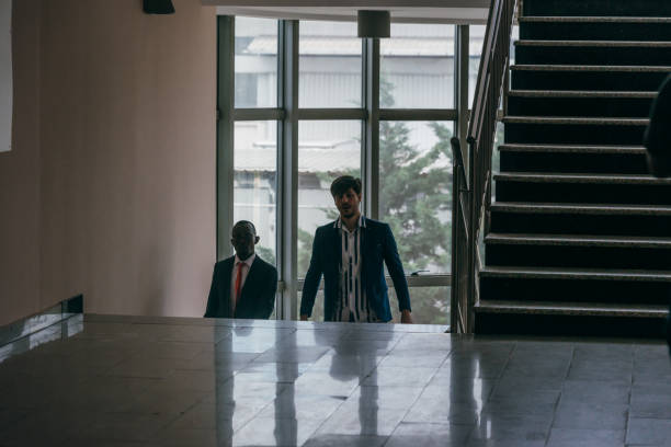 istock Business people standing in a corporate building. While discussing business ideas. 1370326094