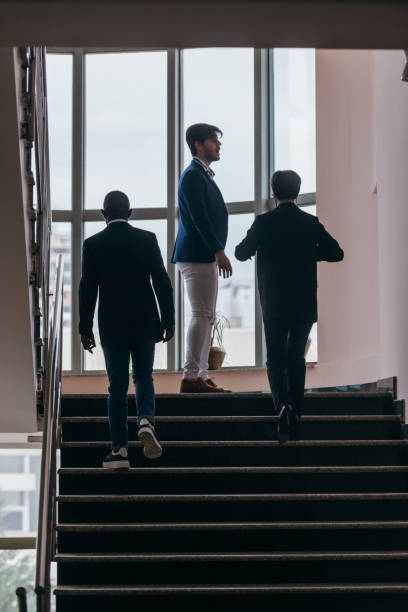 istock Business people standing in a corporate building. While discussing business ideas. 1370326098