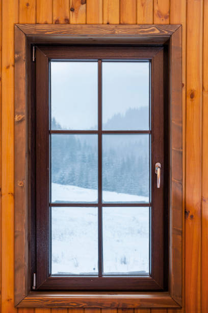 istock Window with a view to the outside in Schneelandschadft 1370326759