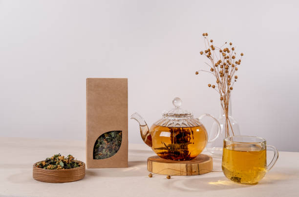 istock Organic tea branding and packaging mockup. Blank tea packaging mockup with tea. Kraft paper pack with window and empty space to display your branding design. 1370328911