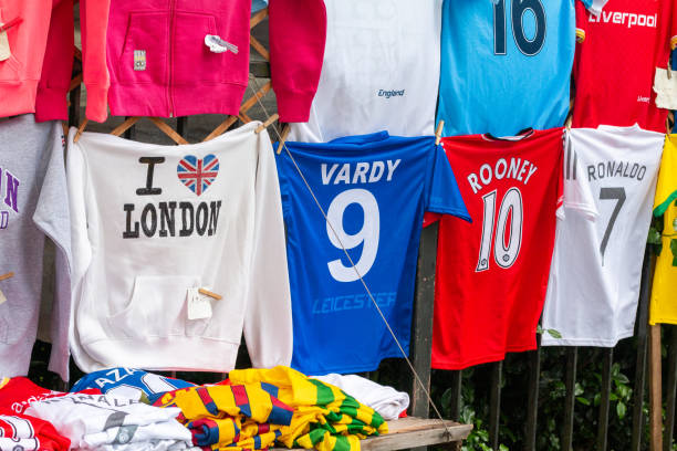 Soccer Uniform Souvenirs in Piccadilly, London Soccer Uniform Souvenirs in London, England. They include 'I love London' shirts as well as football shirts naming Vardy and Rooney. wayne rooney stock pictures, royalty-free photos & images