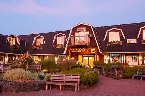 Cannon Beach, USA - September 7, 2021. Sandpiper Square shopping center at dawn in downtown Cannon Beach, Oregon, USA