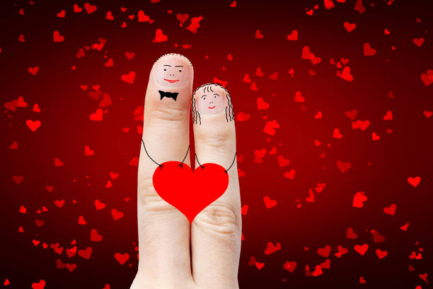 istock A loving couple holds a red heart with their hands. 1370335342