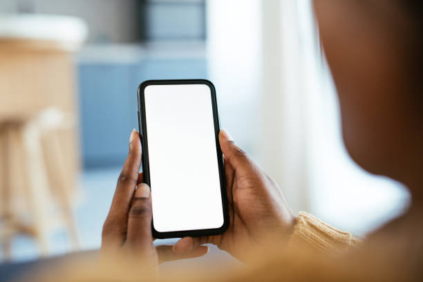 istock African-American unrecognizable woman holding smart phone with white screen 1370336014