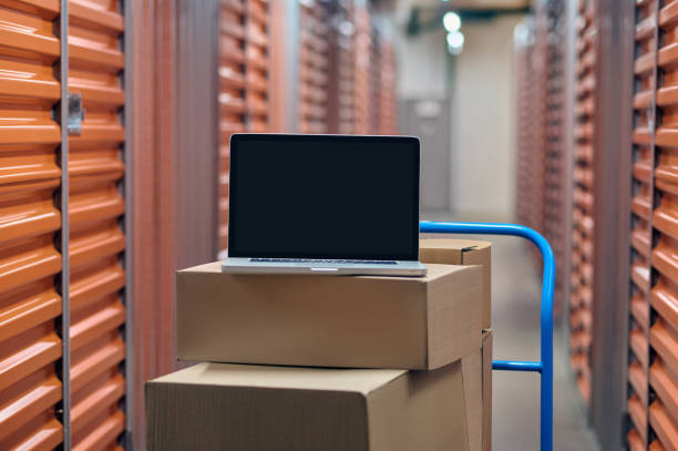 istock Unboxed new portable computer positioned on the warehouse cart 1370336076