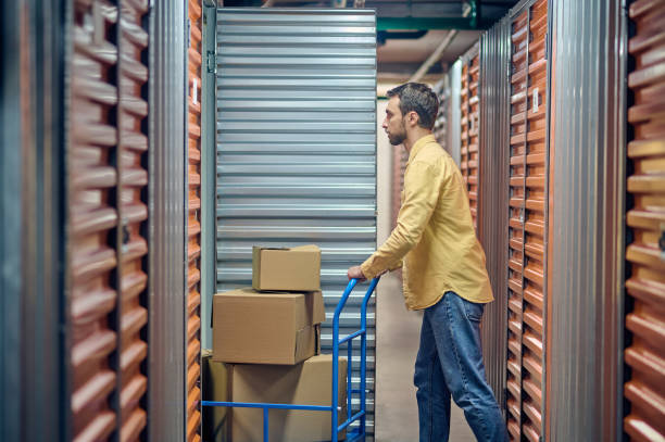 istock Male worker entering the open shipping container 1370336211