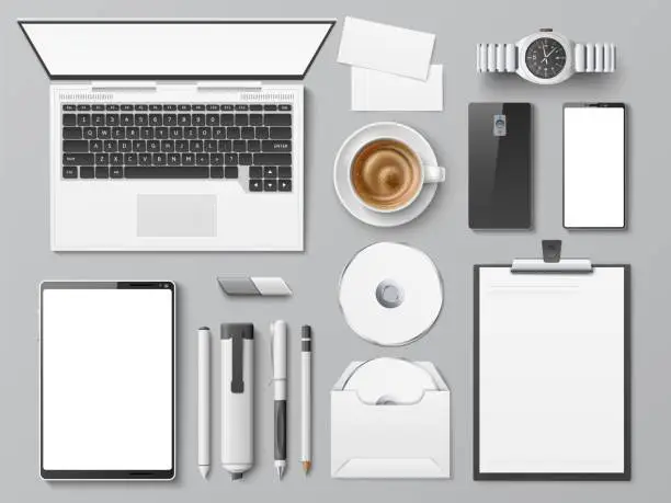 Vector illustration of Realistic desktop top view. Office workplace with different supplies. Digital device. Stationery or tablet. Coffee cup. Visit cards. Computer disk. Vector set of business identity mockup