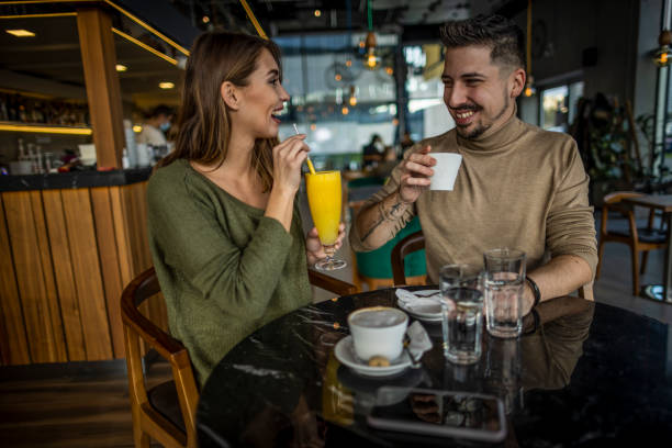 istock Happy young couple in cafe 1370336513