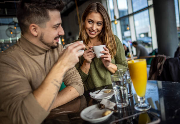 istock Happy young couple in cafe 1370336659