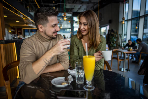 istock Happy young couple in cafe 1370336861
