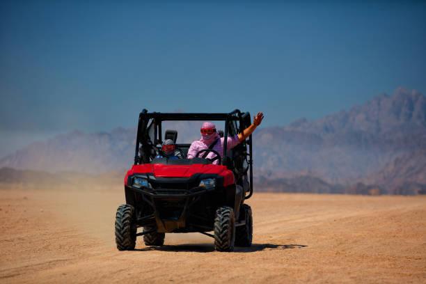 istock driving a buggy car through the desert. thrill safari adventures 1370336897