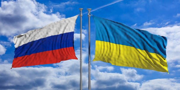istock Russia vs Ukraine, crisis. National flag flying opposed on cloudy sky background. 3d render 1370337073