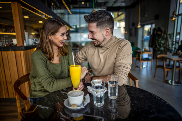 istock Happy young couple in cafe 1370337823