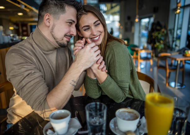 istock Happy young couple in cafe 1370337859