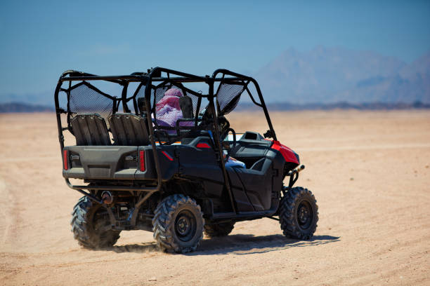 istock riding a buggy car through the desert. thrill tourism adventures 1370338100