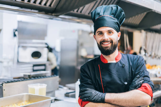 istock Portrait of confident chef standing at restaurant kitchen 1370338342