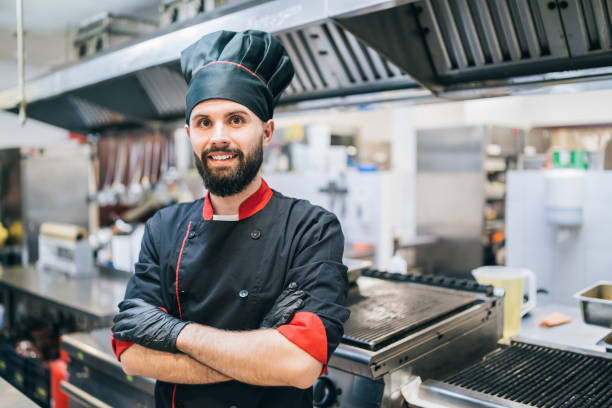 istock Portrait of confident chef standing at restaurant kitchen 1370338345