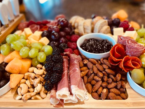 istock Surface level tabletop view charcuterie board - stock photo 1370339184