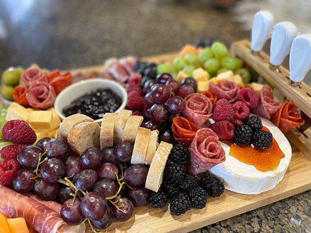 Surface level tabletop view charcuterie board - stock photo