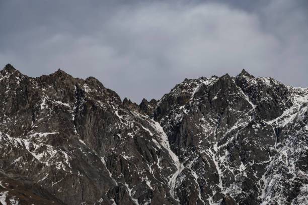 istock Beautiful winter mountains landscape. High snow covered rocks. 1370339373