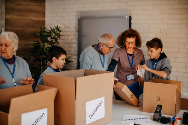 istock Packing food donation in cardboard box 1370339773