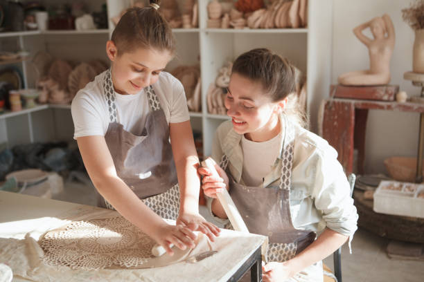istock Mother and son enjoying making pottery together 1370339881