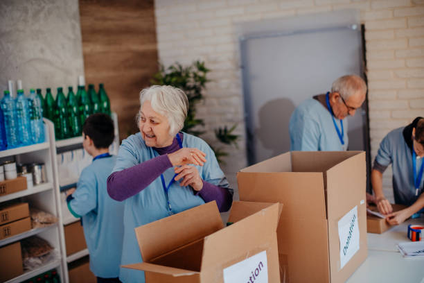 istock Multi-generation family preparing food donation 1370339978